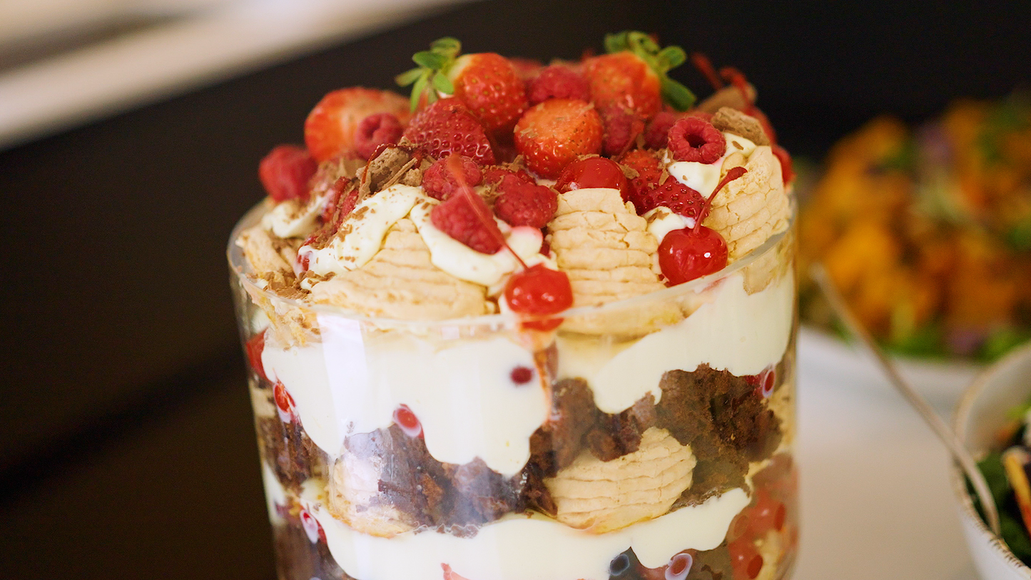 Chocolate pavlova trifle served in complimentary footed glass trifle bowl